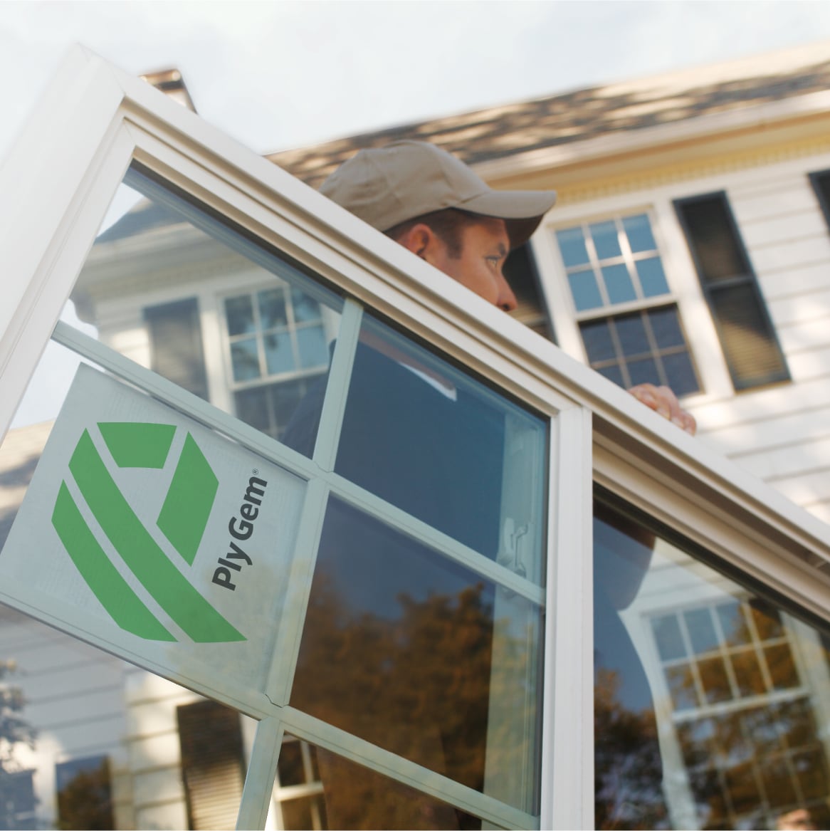 An Installer Carrying a AMBLA INC Replacement Window
